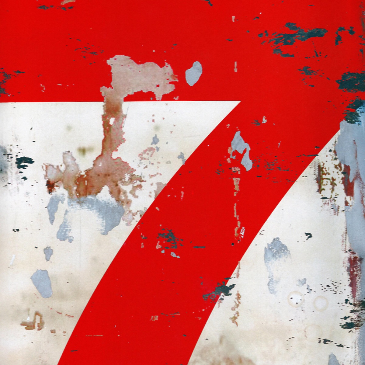 Album Art of The 77s's 7 album - It looks like a cement wall or floor or something where the majority of it is white but a large, red '7' takes up the entire top and the middle of the vertical space. It looks like a wall or floor because there's many different spots where the paint or the finish has worn away and you can see various colors or textures through it, and maybe also a few other bits where something scraped against it and left some color too.