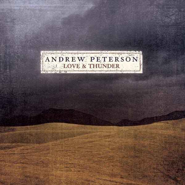 Album Art of Andrew Peterson's Love And Thunder album - A beautiful but simple painting of a barren, brown landscape of rolling hills of brown with larger, darker hills in the background. The sky is a dark blue, almost gray or black, except for a bit more light in the top left. In the middle of the sky, a faded white square is on top of the painting and has the artist name printed in a dark blue and the album title below it in a slightly smaller, dark red.