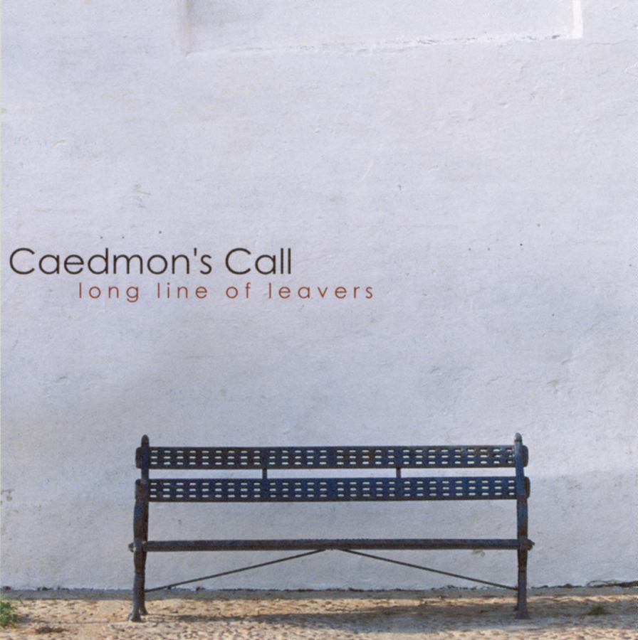 Album Art of Caedmon's Call's Long Line Of Leavers album - A color photo of a black metal bench at the bottom on a cobblestone walkway. Behind it, a white painted wall takes up most of the space of the photo. On the left side in the center, in dark grey is printed the band's name, and in a reddish-orange under it is the album title in lowercase.