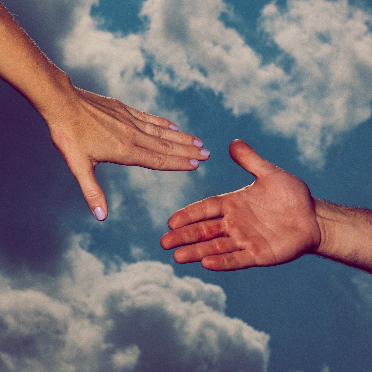 Album Art of Colony House's 77 (Pt. 1) album - A photo of a blue sky background with intermittent white clouds from below. From the right side is a man's large hand extended and a woman's smaller hand with purple painted nails is extended from the left. The two hands look they are about to be clasped together in a moment in the middle of the frame.