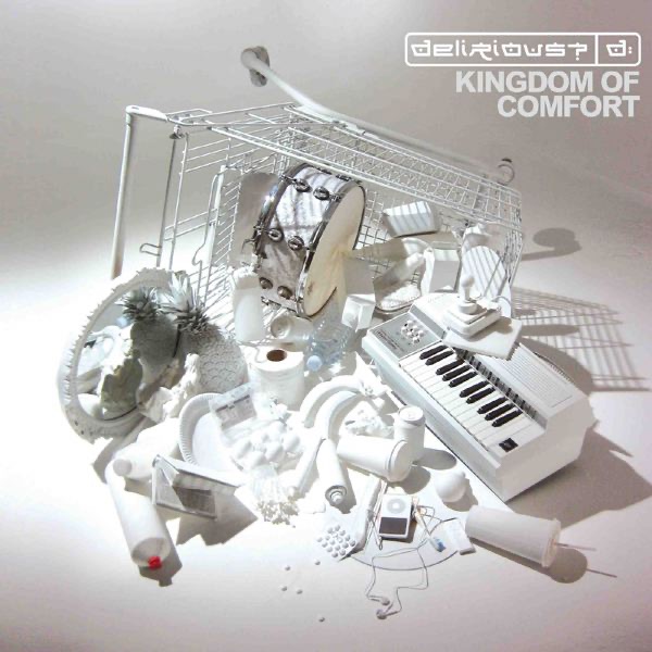 Album Art of delirious?'s Kingdom Of Comfort album - On a gray background, a photo of a white shopping cart that has been tipped on its side towards the camera and is lying on the ground. Spilling out of it is a whole bunch of random things, all colored white. Still in the cart is a snare drum, cartons of milk or other drink, and other foodstuffs. On the right, mostly out of the cart is a small electronic keyboard that is also mostly white.</body></html>