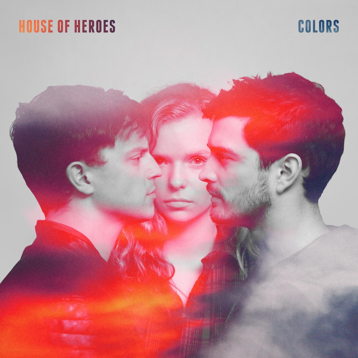 Album Art of House Of Heroes's Colors album - A photo of three people, two young men photographed from a profile facing each other, with a woman facing the camera between them. The man on the right has longer hair and short, facial hair, while the person on the left has no facial hair. The woman between them has curly brown-blonde hair, though the photo of all of them seems to be black-and-white with swatches of purple, red, and orange painted on top of the picture. In the top left, it has the band's name printed in orange to purple gradient, with the album title in the top right in more a blue-purple gradient.
