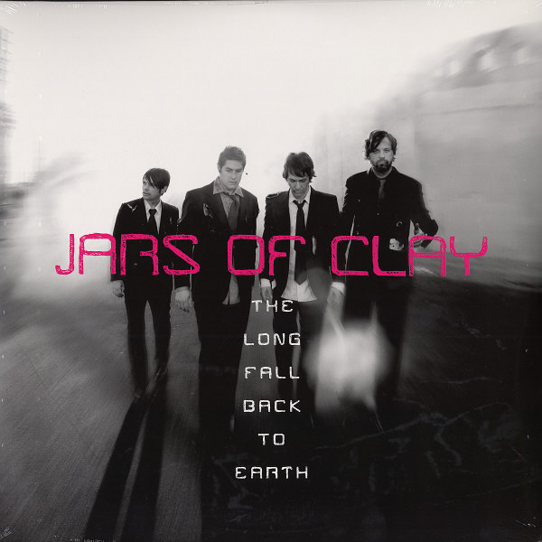 Album Art of Jars of Clay's The Long Fall Back To Earth album - A black-and-white photo of the four white men that make up the band, with the edges of the photo fairly hazy and/or smoky. All four members are wearing black suit coats and pants and most are not looking at the camera, maybe they are walking. The band's name is in large pink letters right over the photo in the center.</body></html>
