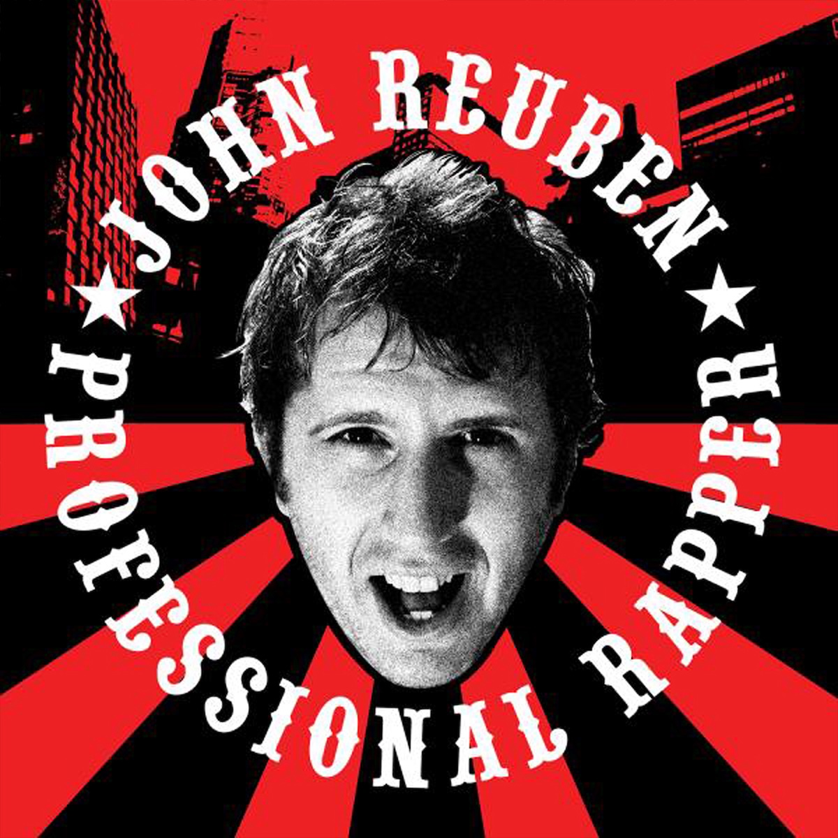 Album Art of John Reuben's Professional Rapper album - A black and white photo of a young white man's face cut out on a red and black background. On the top half, it's a red cityscape with black buildings, and on the bottom half it's red and black thick lines emanating out from his face. Around his face is a circle that has the artist name and album name printed in a white font with stars separating them.