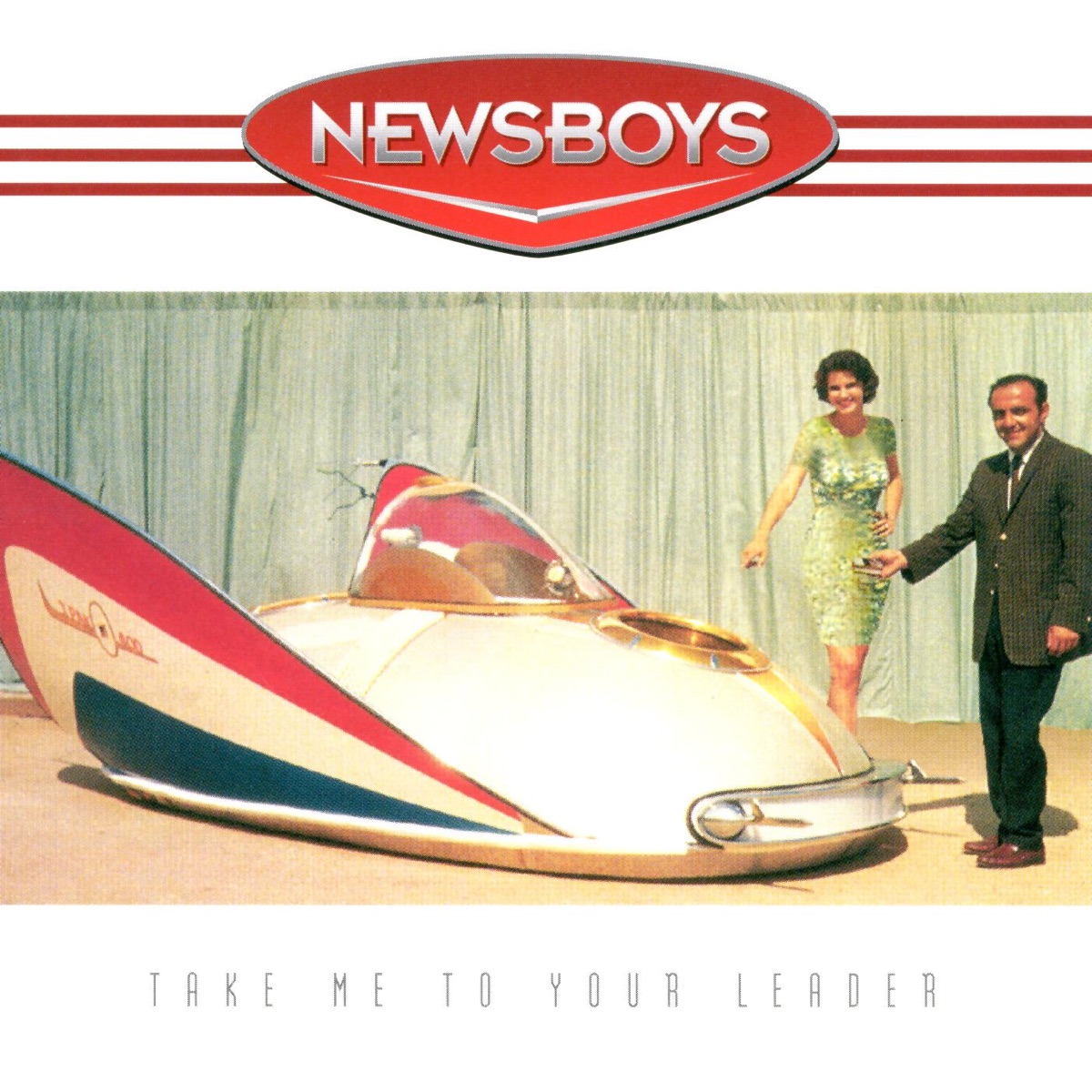 Album Art of Newsboys's Take Me To Your Leader album - On a white background, at the top is a few red lines and a red circle with a point on the bottom and the band's name printed in a gradient that looks kinda like chrome, with a chevron below it. At the bottom in a very thin, black font is the album title. In the middle is a photo of a very space-age concept vehicle of some sort. The bottom looks flat to the ground and in an oval shape, and there is a glass windshield in a little part in the middle for one person to sit. There's comically big fins on each side in red, white and blue. Behind the vehicle is a light green cloth background. And to the right of the front of the vehicle, a woman in a green dress and a man in a suit are smiling, looking at the camera, and pointing at the vehicle.