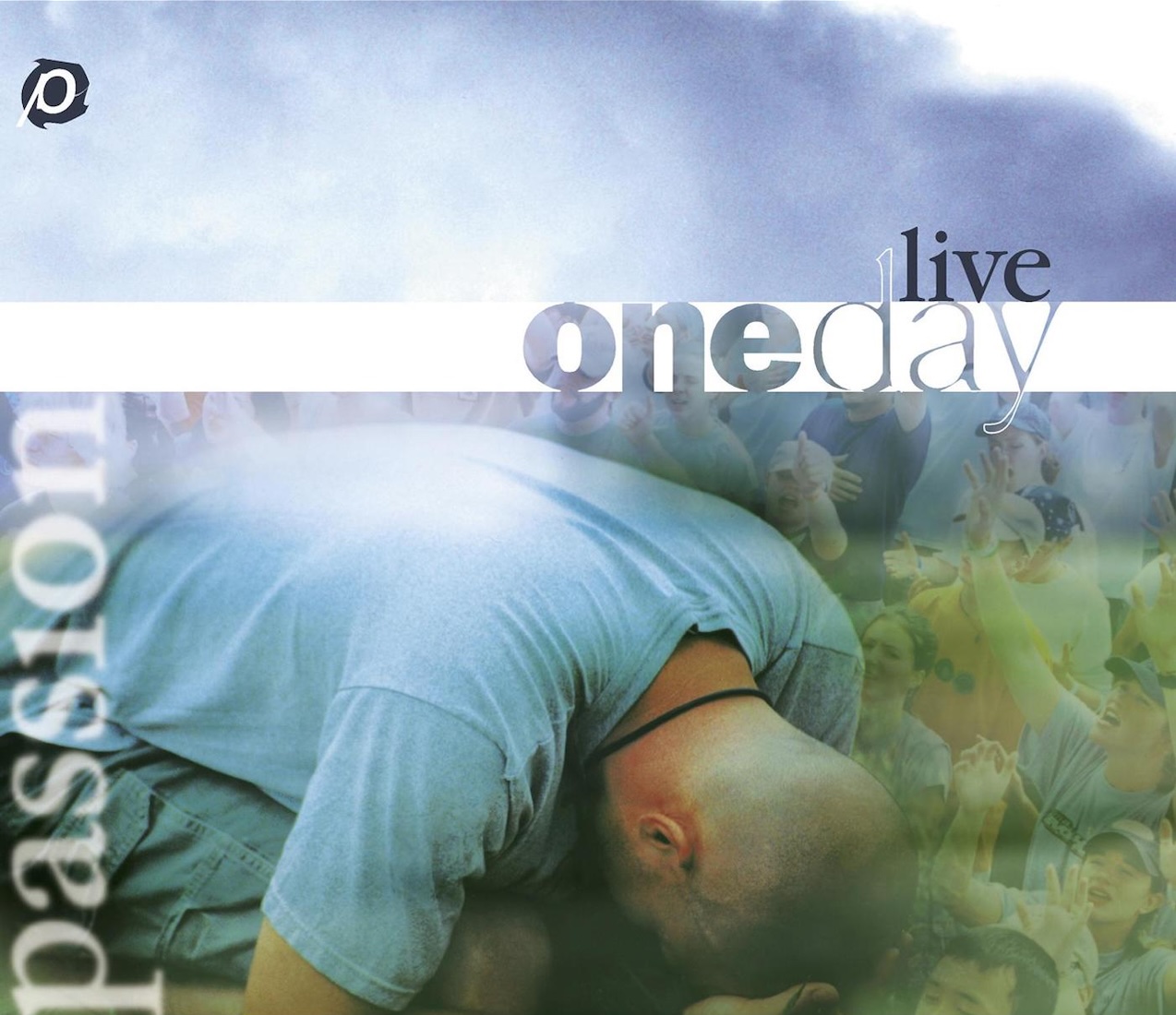 Album Art of Passion's OneDay Live album - A photo of a man kneeling on the ground with his head right at his knees and his head looking down into the ground, probably in prayer. Above him, the blue sky and next to him, layered in with the sky is a semi-transparent photo of dozens of people with their hands lifted in prayer and praise. On the left side, it has the word 'passion' in a semi-transparent, blurry white. In the top left, there's a 'p' wheel logo in white and black.</body></html>