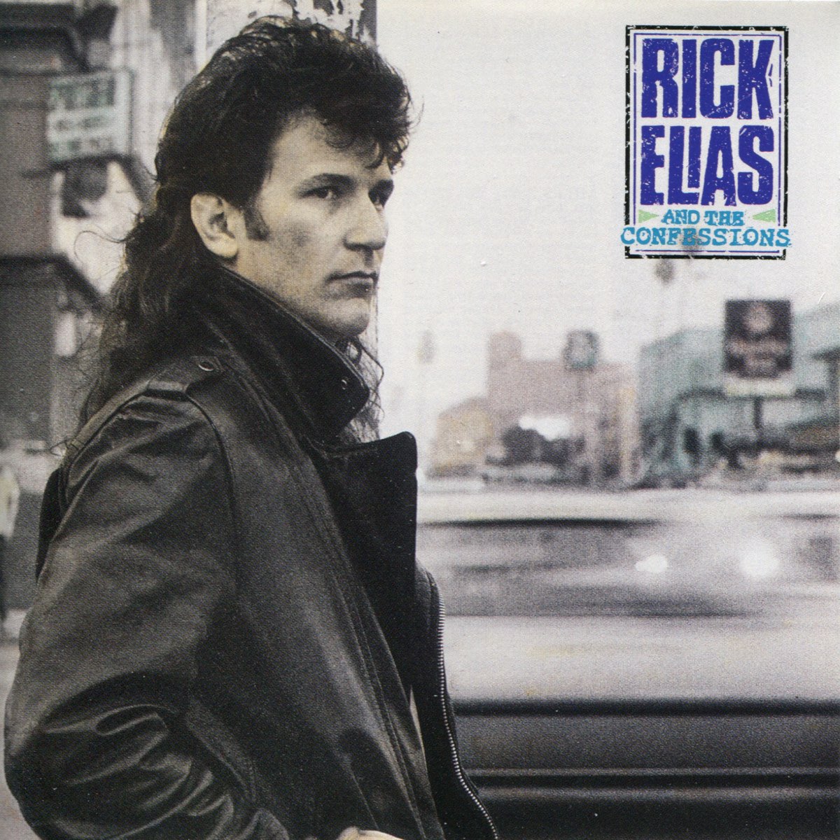 Album Art of Rick Elias And The Confessions's self-titled album - A mostly desaturated photo of a man standing next to a busy city street, shown from the waist up in a leather jacked and with long, dark curly bangs and long hair in the back. Behind him, we can see the blur of a car moving past. In the top right, printed on top of the photo's sky portion is a black rectangle with a dark blue, slighly-purple hairline inside the square.</body></html>