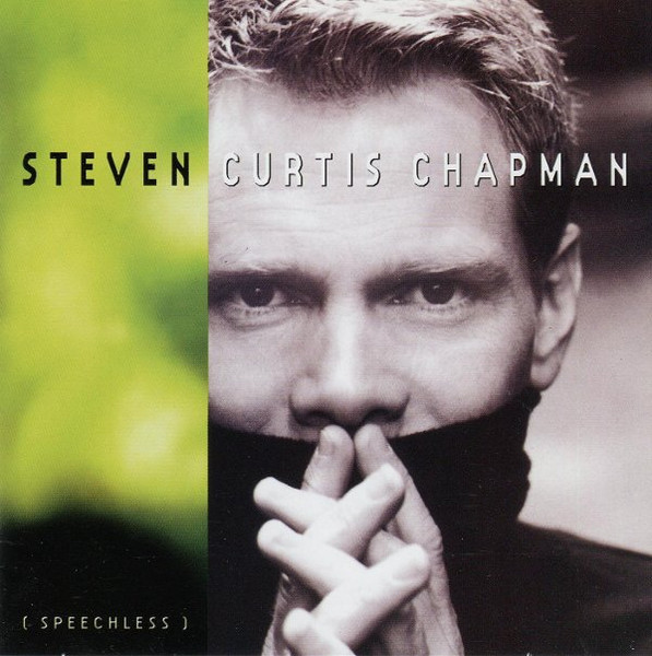 Album Art of Steven Curtis Chapman's Speechless album - On the left side, the background is a blurry green and gold, maybe a blurry shot of some bush or something, fading to black at the bottom. On the right two thirds is a somewhat desaturated photo of a middle-aged man with short, light hair wearing a turtleneck with the collar covering up his mouth.</body></html>