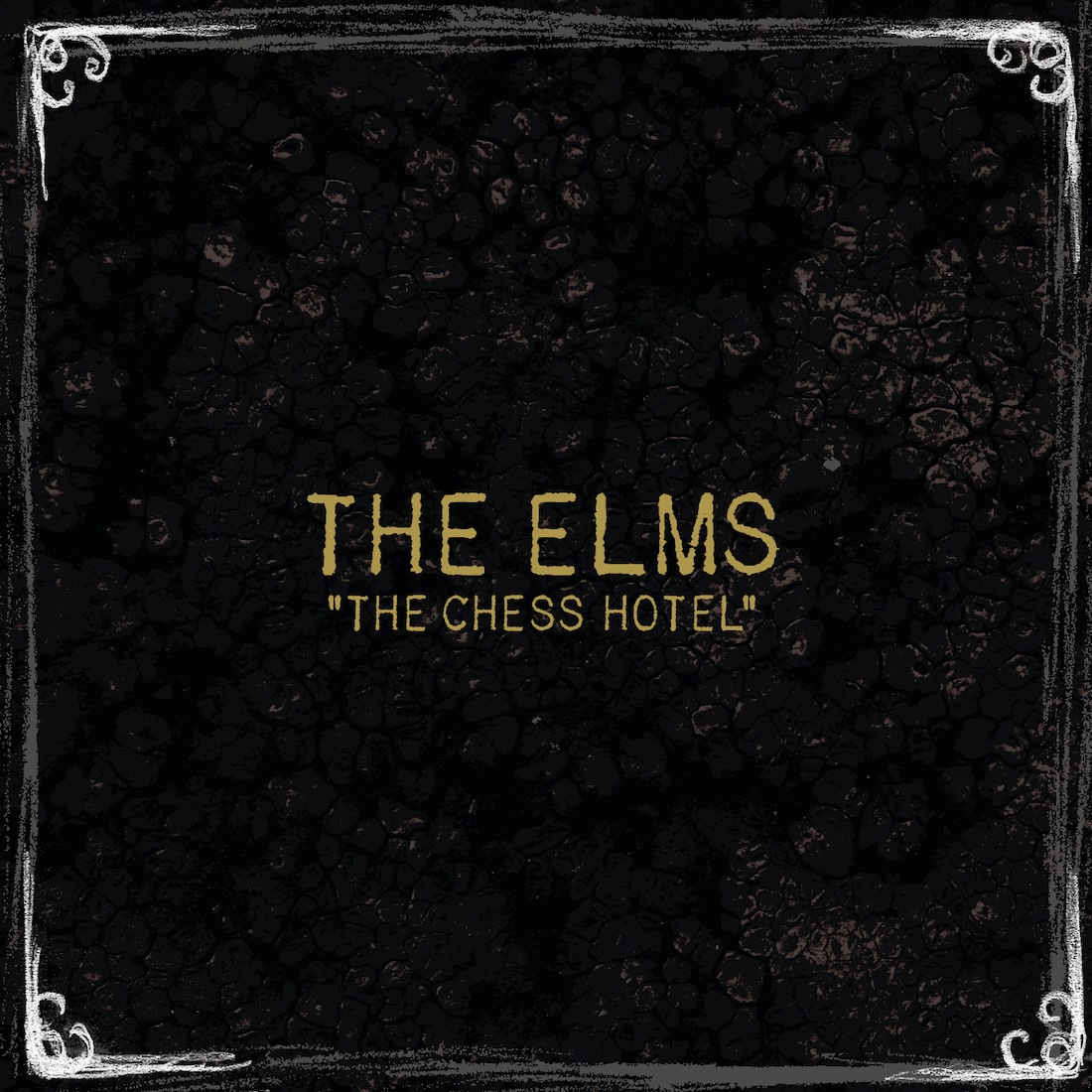 Album Art of The Elms's The Chess Hotel album - A mostly black cover with what looks like hand-penciled white corners on it. In the middle in gold-colored lettering is the band name and the album title below it in quotes and a smaller size. The black background is scuffed in parts like it's supposed to be some sort of worn table or something.