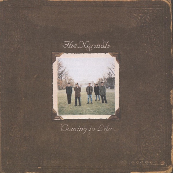 Album Art of The Normals's Coming To Life album - A photo of what looks like a square-shaped, leather bound book cover, with a beautiful leather patina and wear on the edges of the brown cover. In the middle, affixed slightly off-axis from straight, is a photo of 5 men standing in the middle of a large grassy space in front of a classic-looking building in the background. They're standing wearing coats and not really standing right next to each other; more spread apart. Above them is the band's name in a slightly script-like font, and below the photo the album title in similar white font.