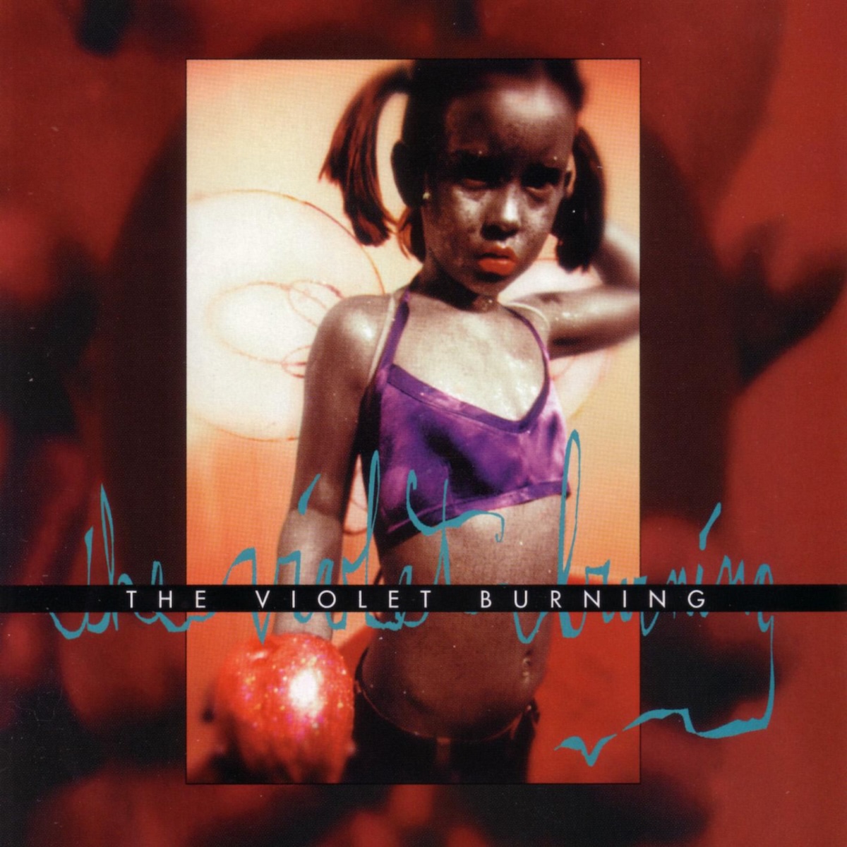 Album Art of The Violet Burning's self-titled album - On a red and black background, a vertical photo of a young girl is in the middle. It's a young black girl wearing pigtails and a purple bathing suit, I think. She's also got what looks like wire and cloth angel wings attached to her back. She's holding a bright red ball in her right hand out towards the camera and has he left hand up behind her head. She's looking down at the camera in a quizzical way. On top of the photo, about three quarters down vertically, a black line goes across and printed in it is the band's name in white text. Behind that black line is the band's name also scribbled in aqua blue paint or thick pen.